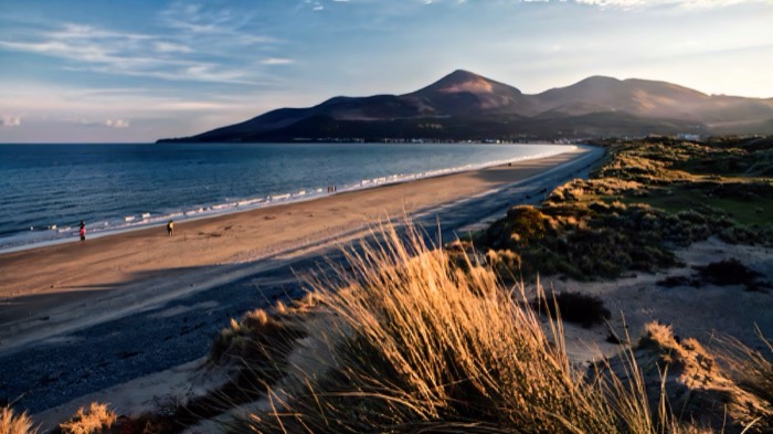 Murlough beach and dunes with the Mourne Mountains sweeping down to the sea