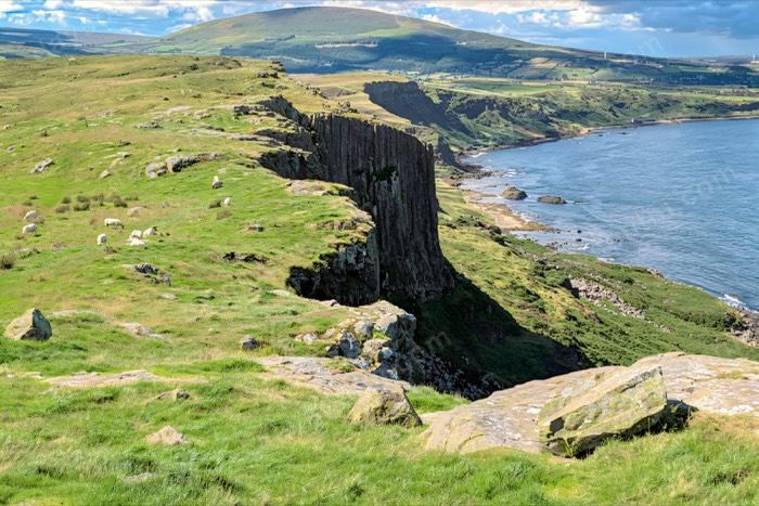 The sheer basalt cliffs of Fair Head above the sea east of Ballycastle