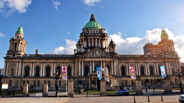 The white Portland stone facade and green copper dome of Belfast City Hall