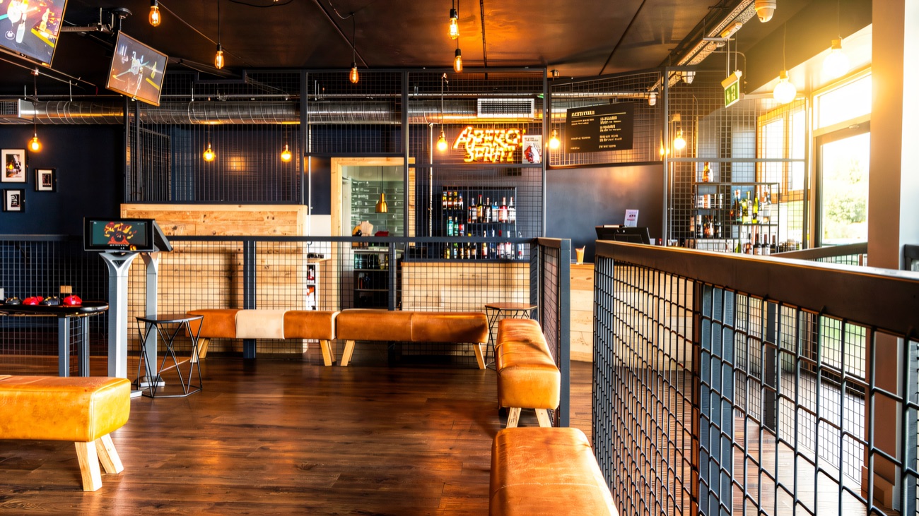 The stylish industrial-chic lounge and bar overlooking the action