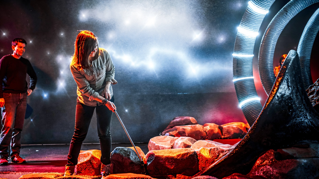 Lining up a putt at the glowing space-portal hole