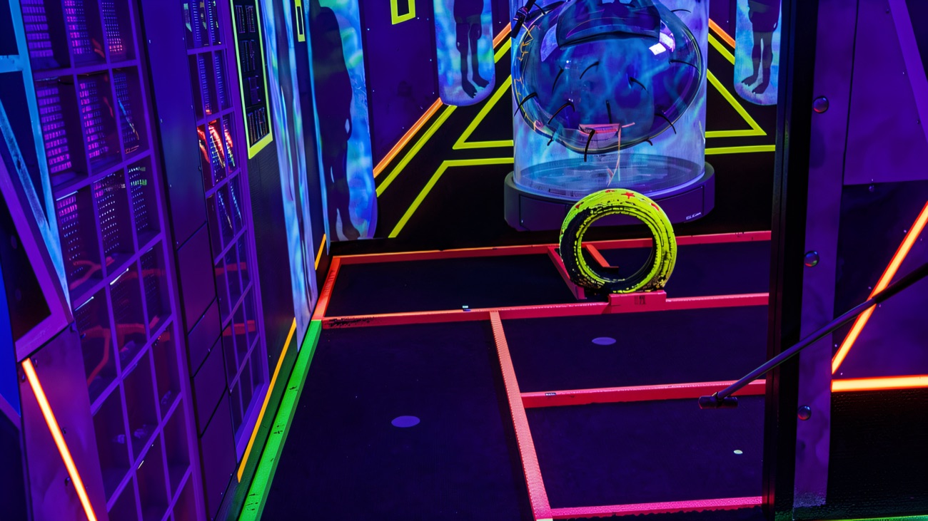 An alien blacklight hole lit up in electric neon