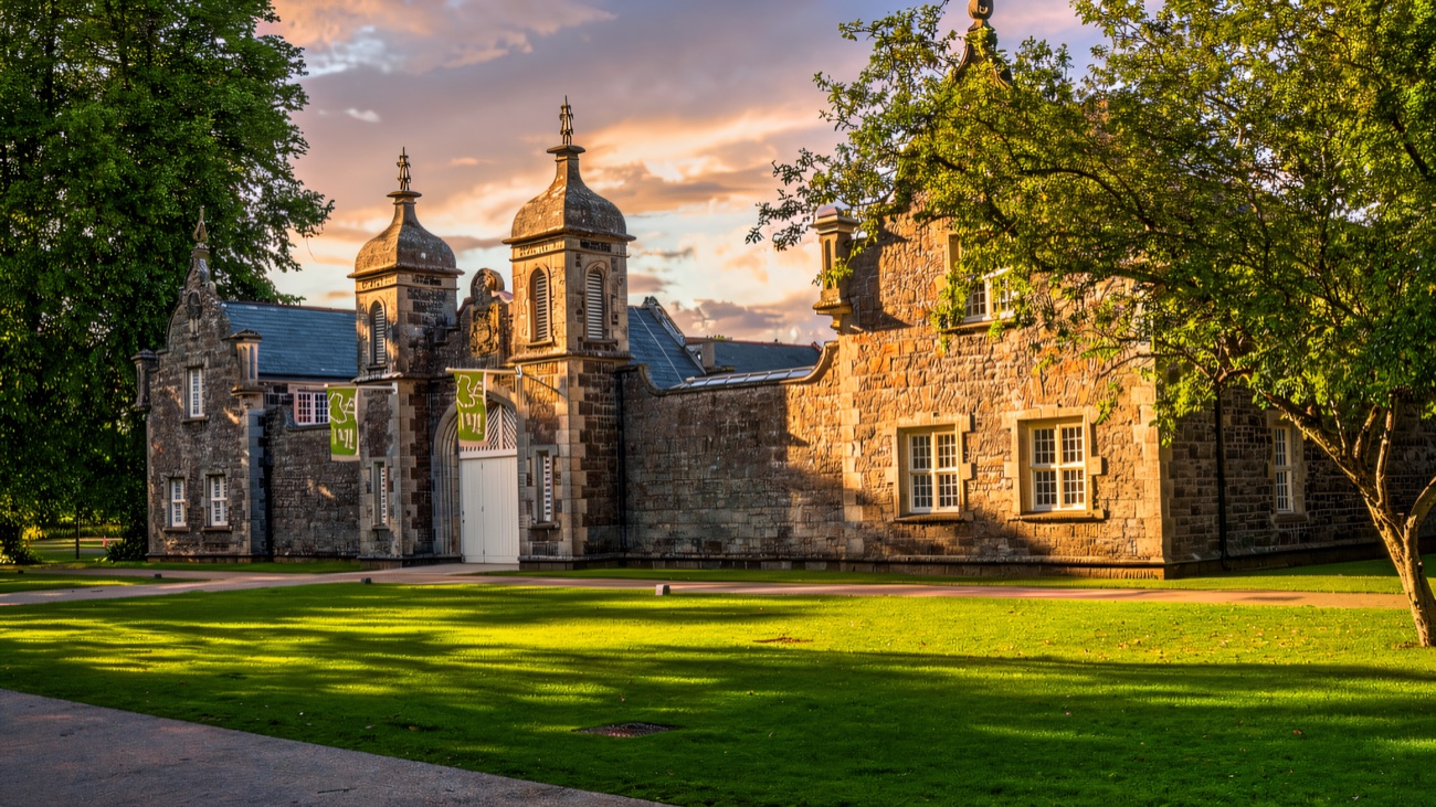 Clotworthy House, the old stone stable block that houses the arts centre and café, in evening light