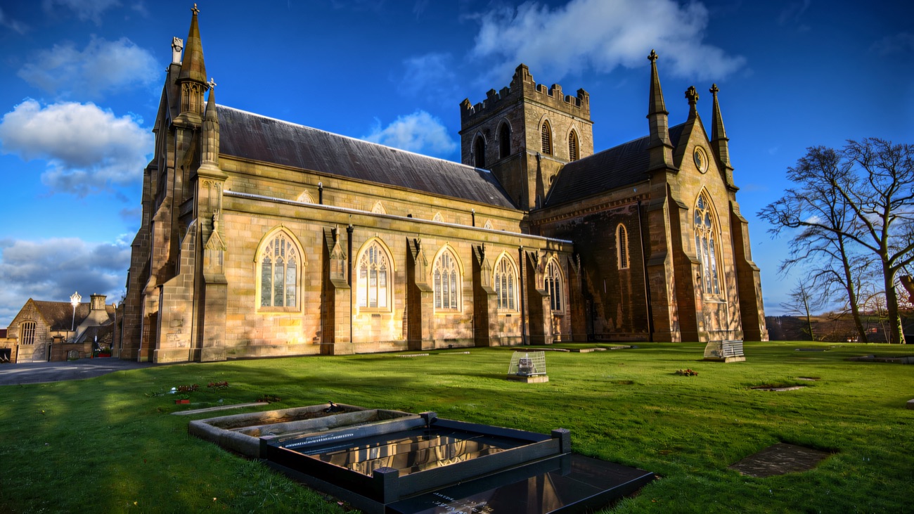 The medieval cathedral on its hilltop, battlemented tower rising against a winter-blue sky