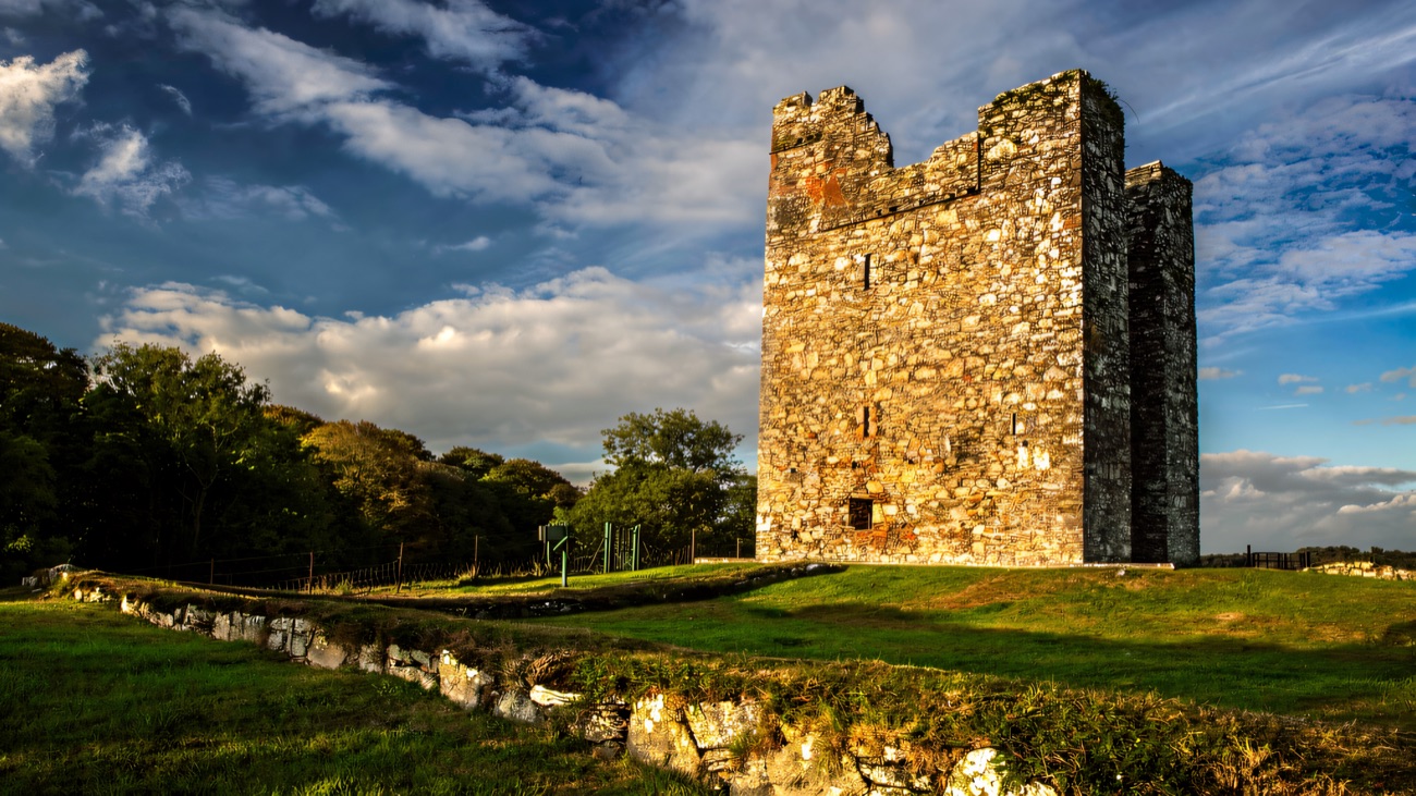 The 15th-century tower house catching low autumn sun above Strangford Lough