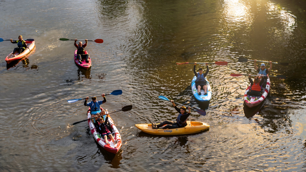 Paddles up and cheering out on the open water
