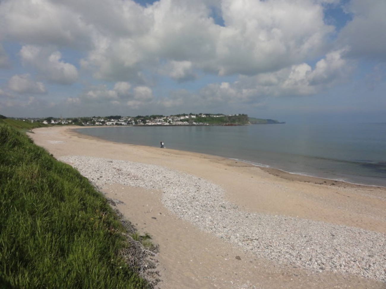 The sand-and-shingle sweep of Ballycastle Beach curving round to the town headland