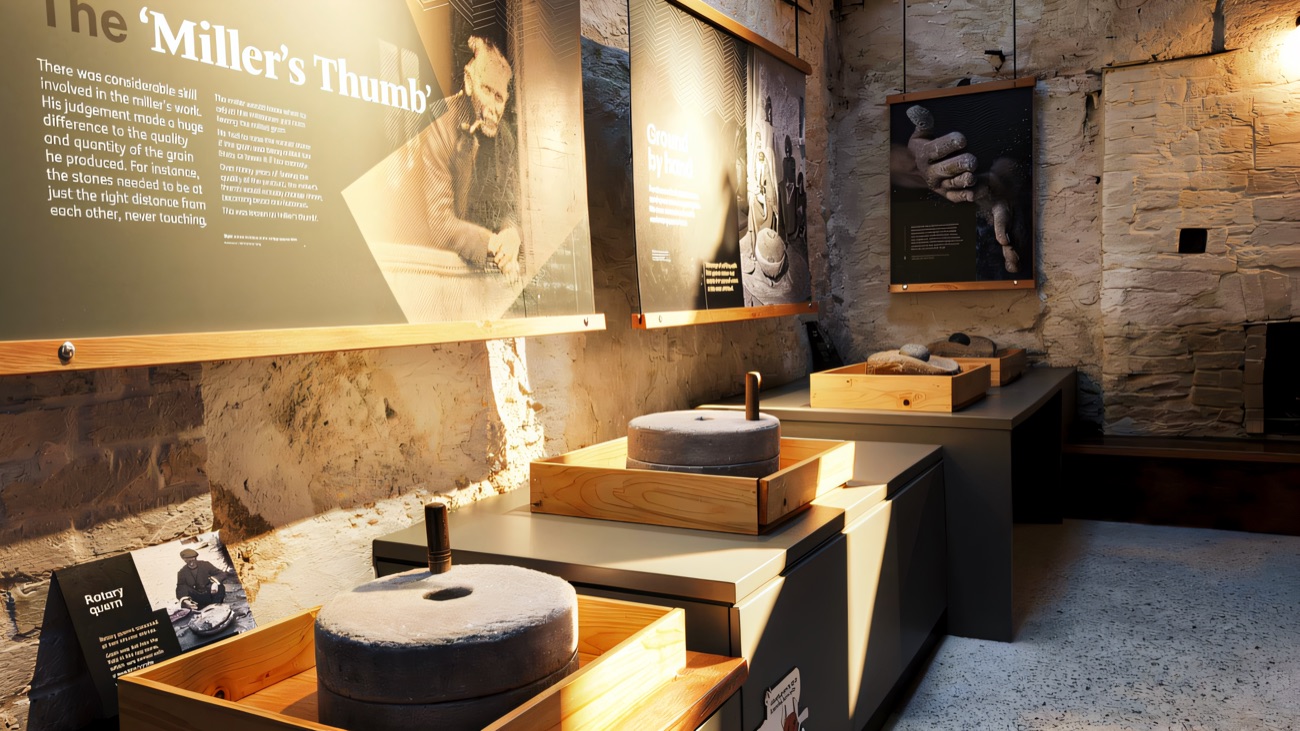 Inside the milling exhibition, with rotary querns and millstones on display.