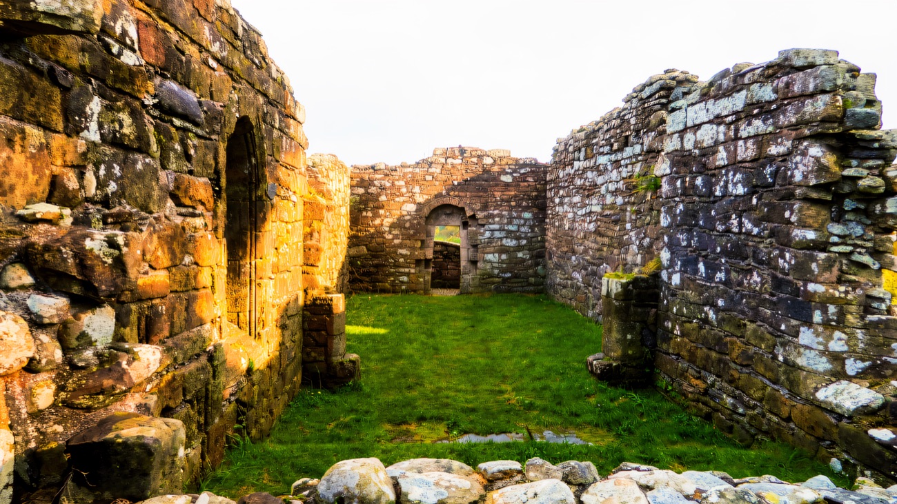 Looking through the ruin, green grass running down the length of the nave