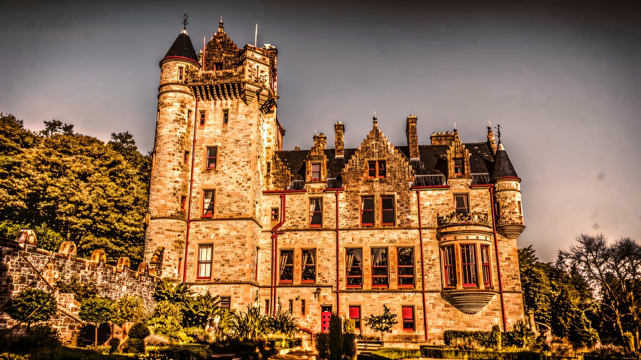 Belfast Castle's Scottish-baronial sandstone towers and turrets against a clear sky