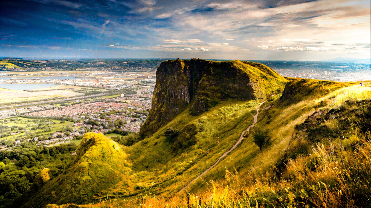 The rocky brow of Napoleon's Nose on Cave Hill with the trail and Belfast spread out below