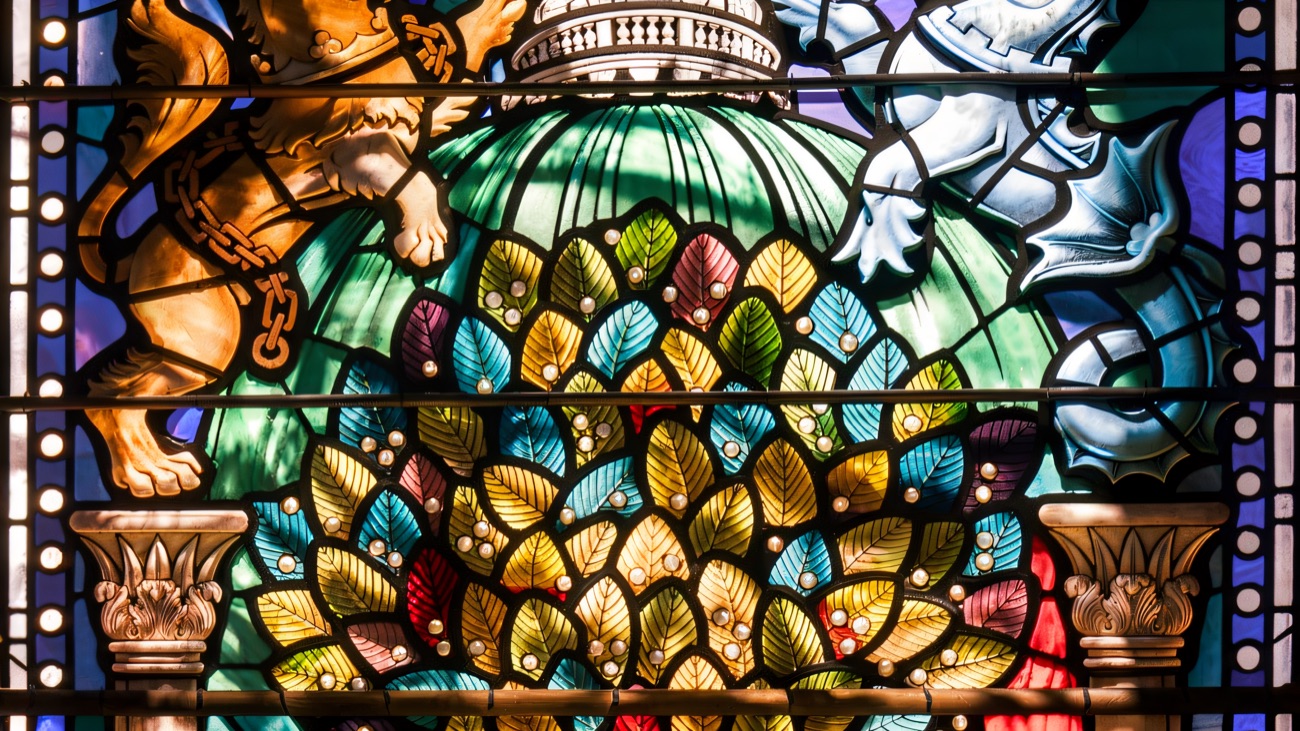 A colourful stained-glass window inside Belfast City Hall marking the building's 1906 to 2006 centenary