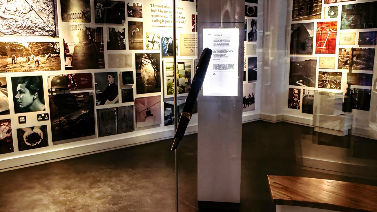 Inside the exhibition at Bellaghy Bawn — a wall of photographs and a touchscreen display telling the story of the place and Seamus Heaney