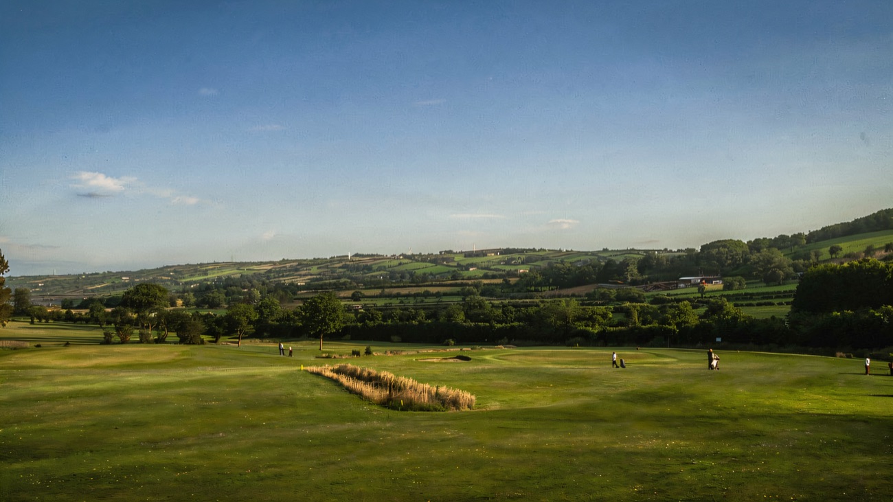 The open Bentra course rolls out across the Antrim countryside