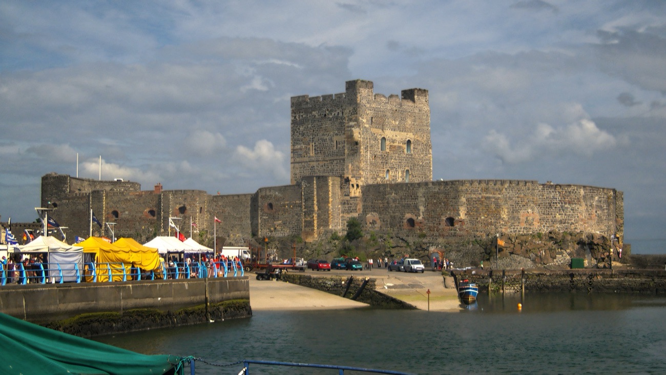Carrickfergus Castle's great Norman keep and curtain walls rising over the harbour on Belfast Lough