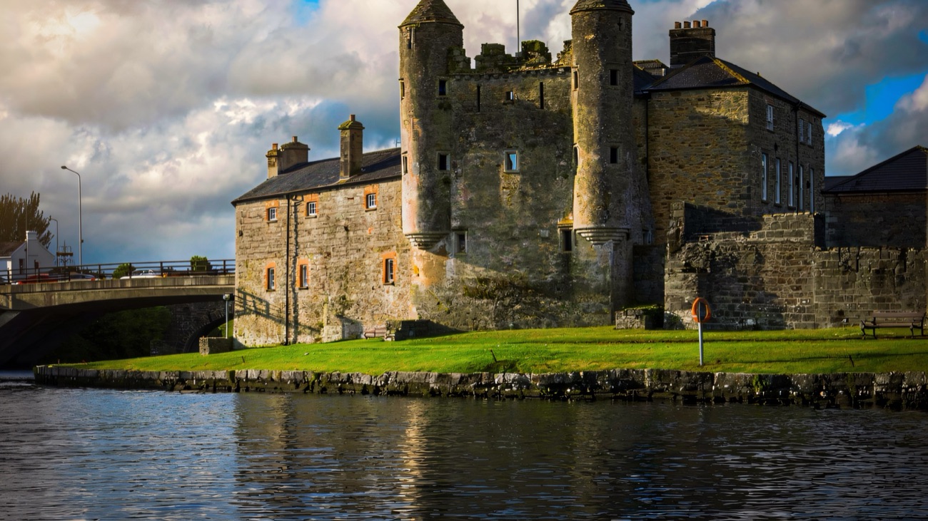 Enniskillen Castle and its twin-turreted Watergate reflected in the River Erne