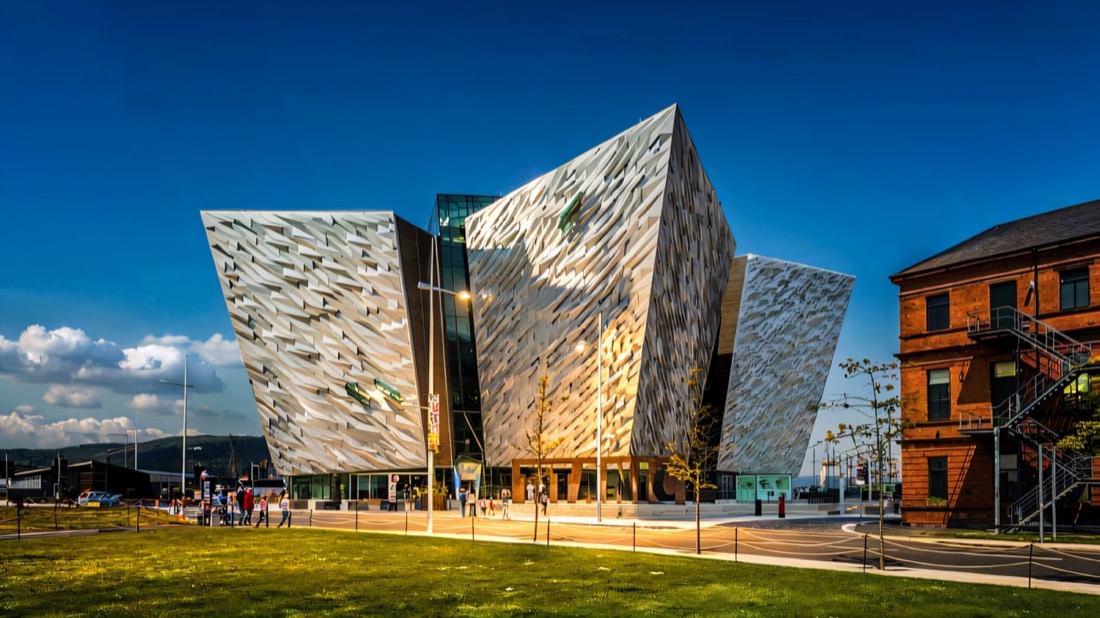 The angular silver hull-shaped building of Titanic Belfast in sunshine