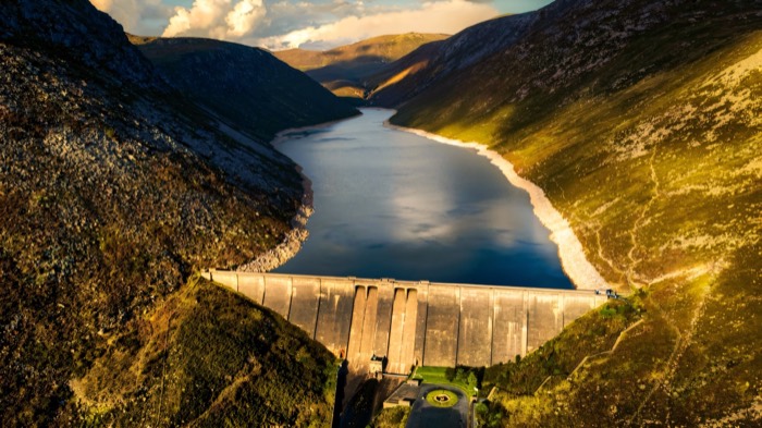 Aerial view of the Silent Valley dam and reservoir ringed by Mourne peaks