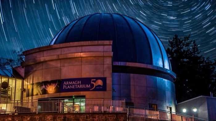 Star trails circling over the dome of Armagh Planetarium at night