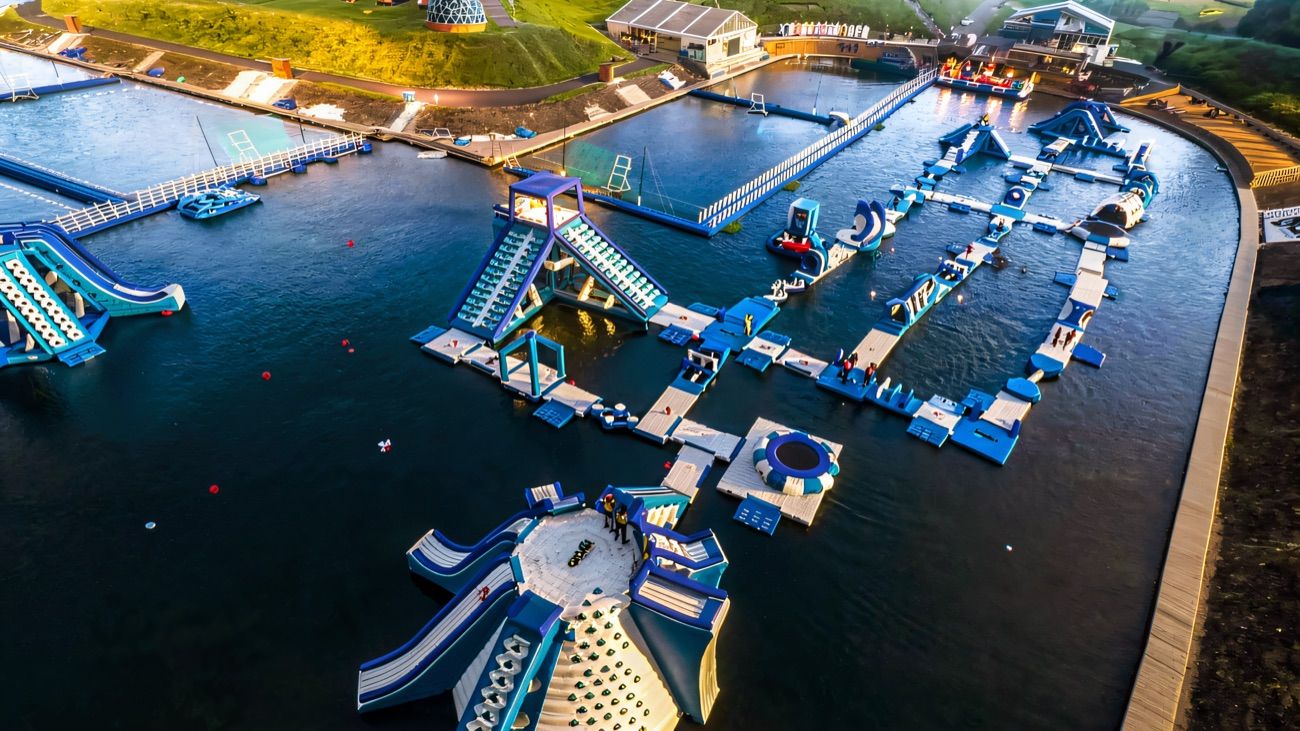 Aerial view of the huge floating inflatable obstacle course on the lake at Let's Go Hydro