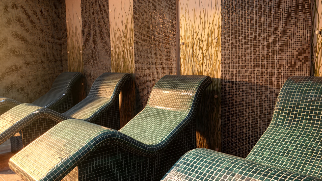 Tiled heated loungers set along the spa wall