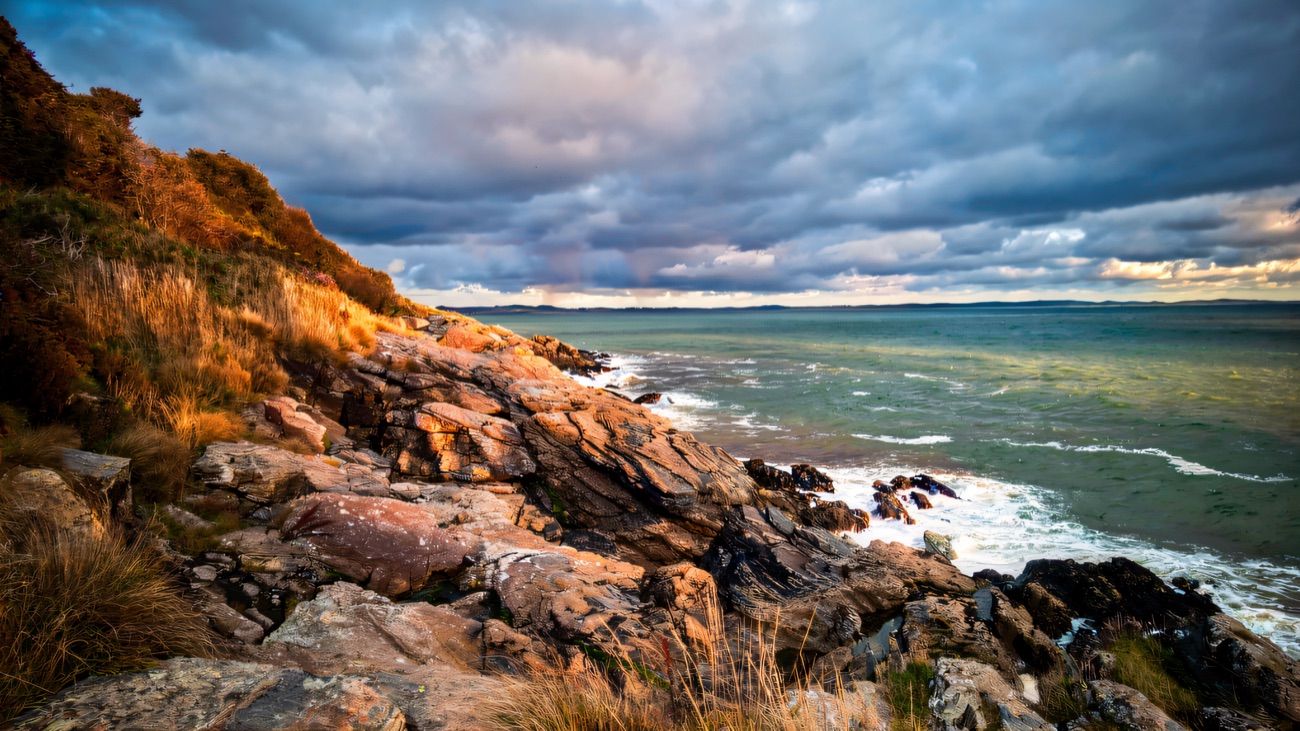 The rocky Mourne shore below the trail