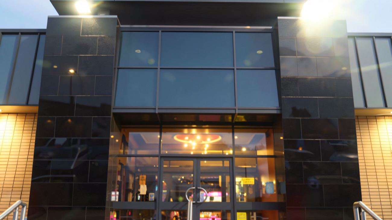 The Moviebowl entrance lit up in the evening