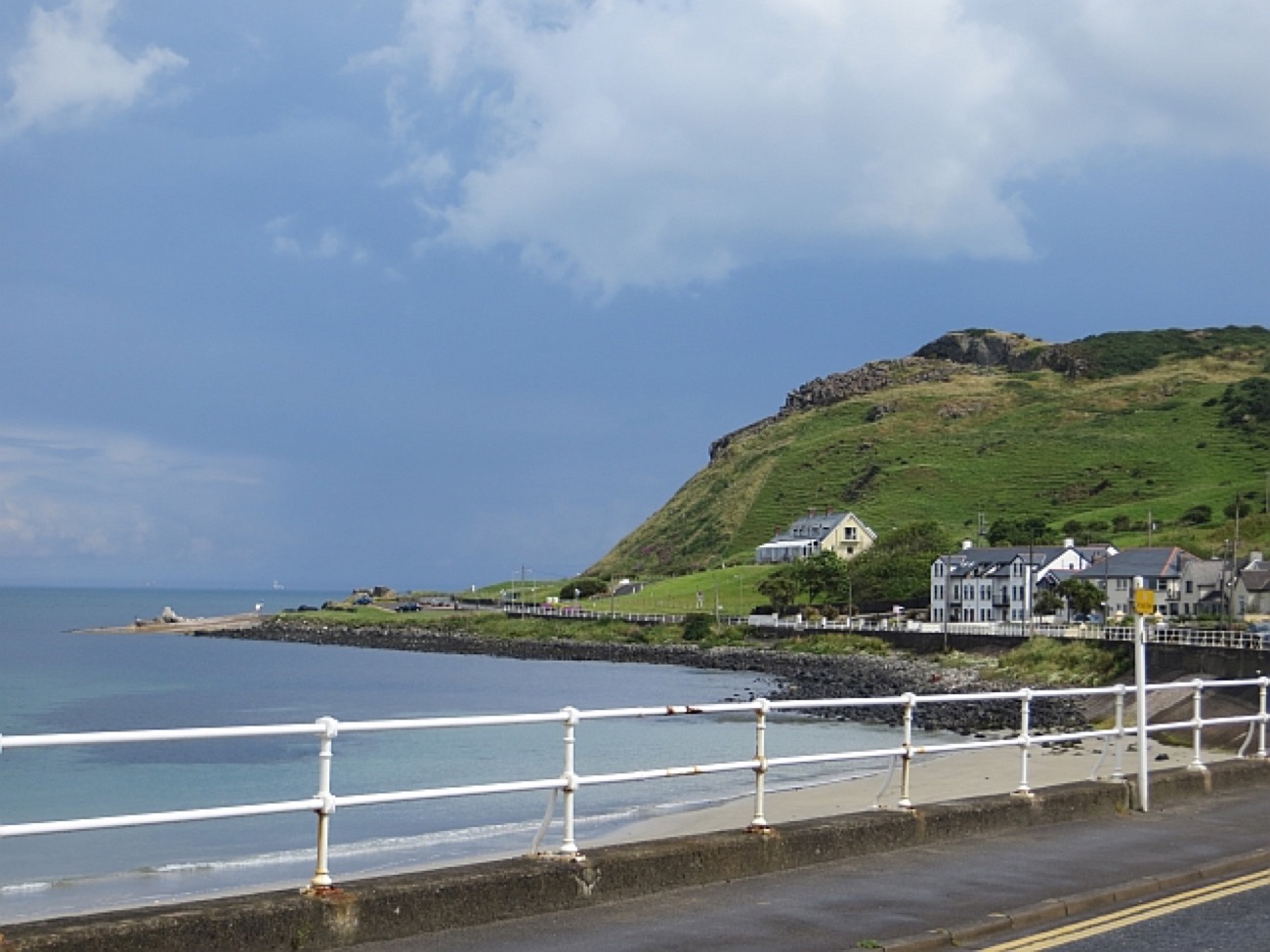 A grassy headland and calm sea view along the Antrim coast near Cairncastle