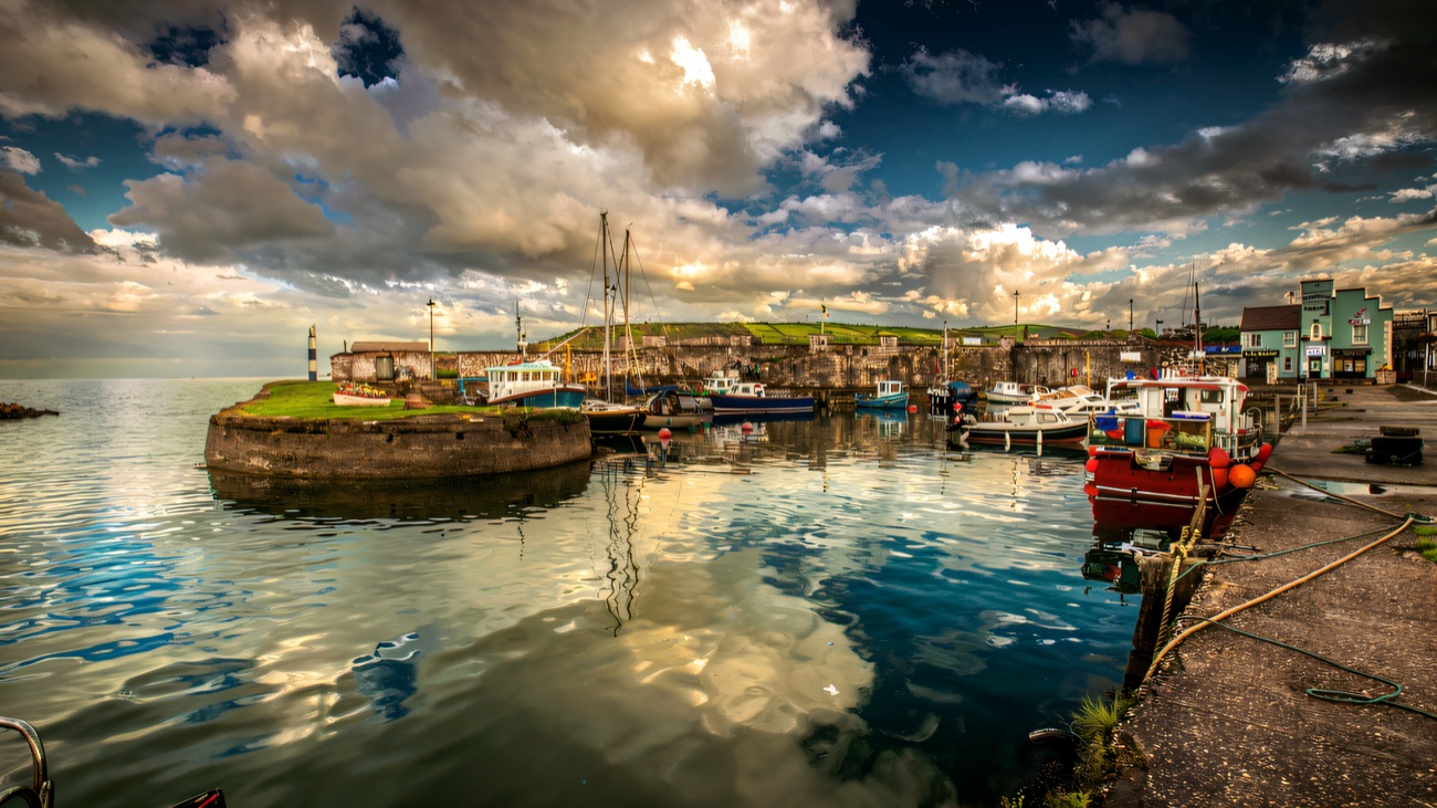 Carnlough's historic harbour with its fishing boats and stone piers