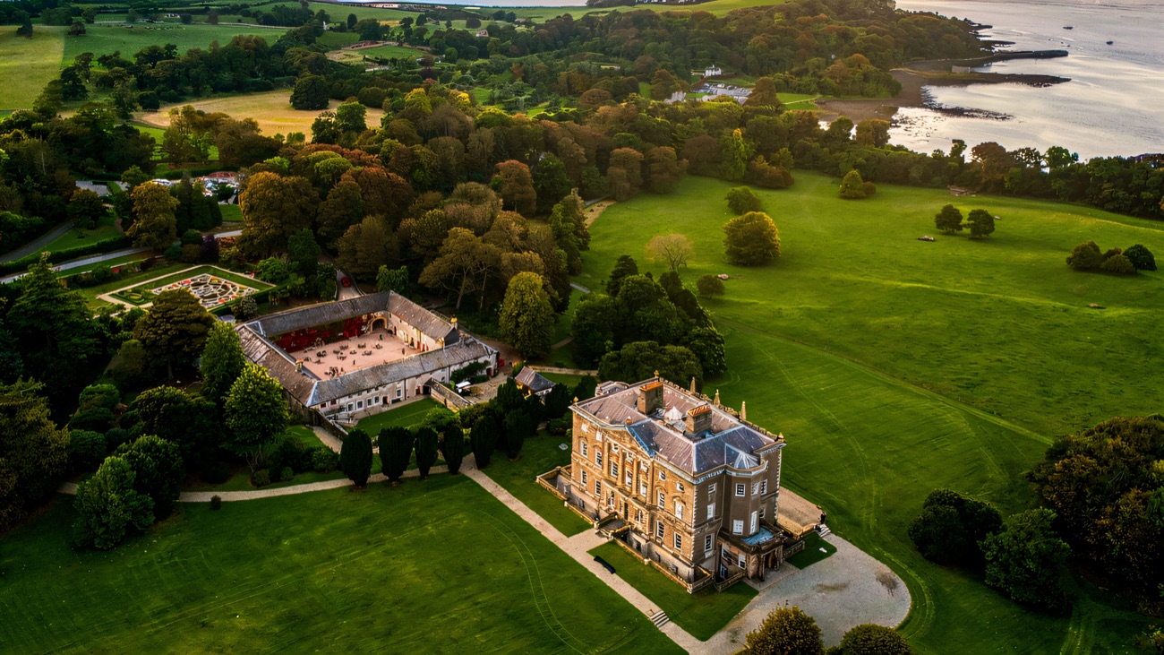 Aerial view of the Castle Ward estate and mansion on the shore of Strangford Lough