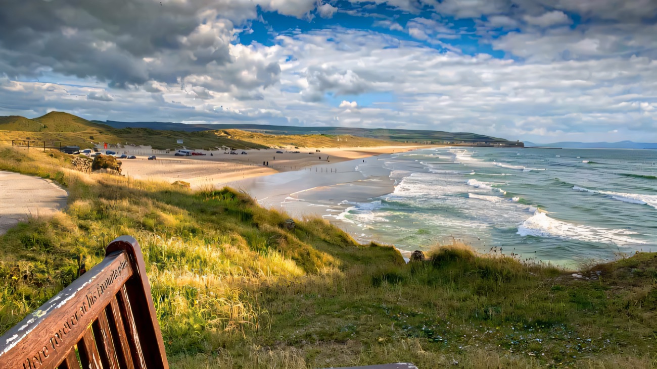 Portstewart Strand sweeps below the route, sand meeting the open sea