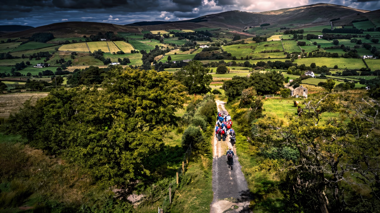 An aerial of the lane threading through the patchwork valley