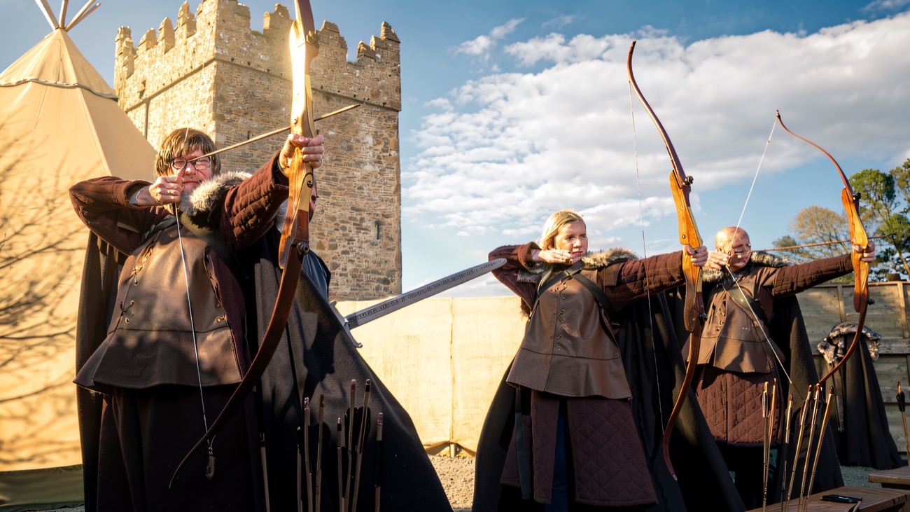 Stark cloaks and longbows against a bright blue Strangford sky