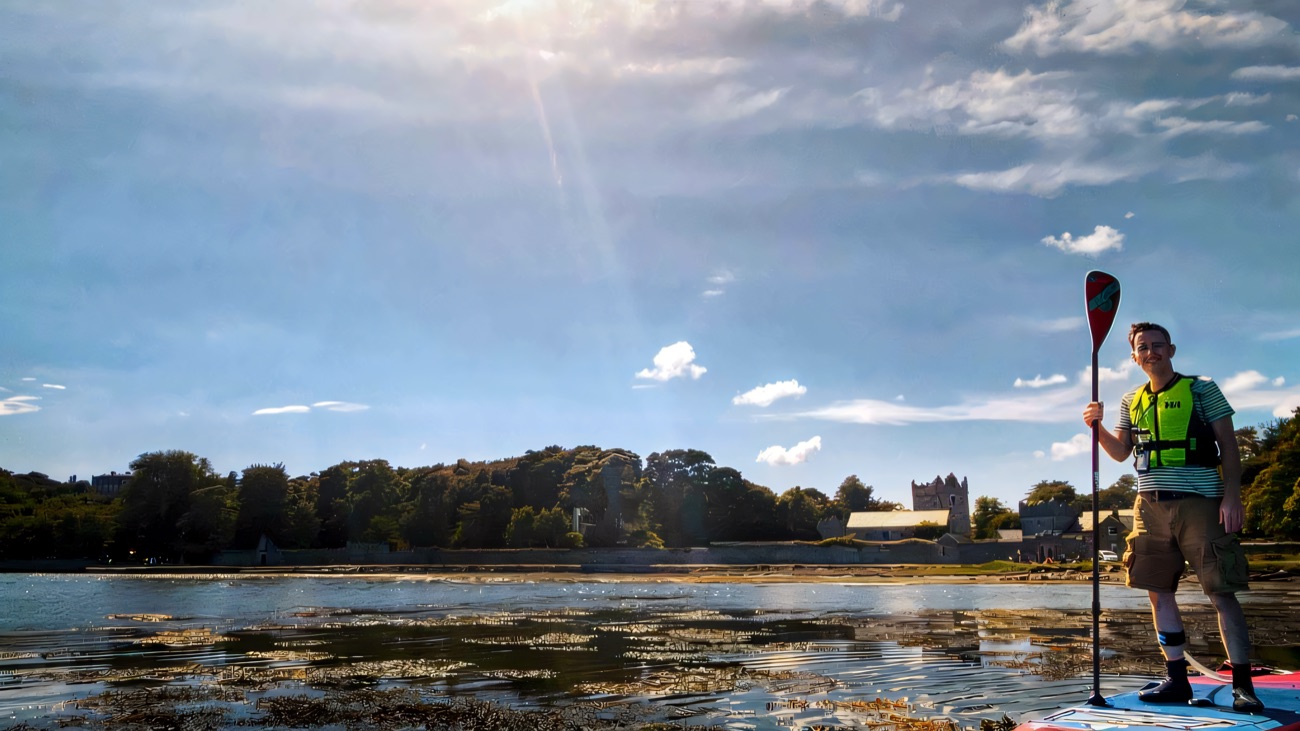 Paddleboarding the glassy lough with the Castle Ward estate on the shore