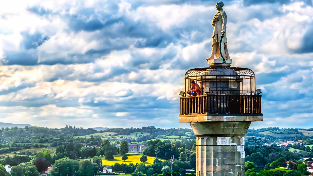 The statue of General Cole crowning the tall column, Fermanagh countryside spread behind