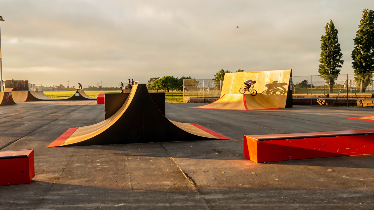 Wide view across the ramps and grind boxes on the tarmac