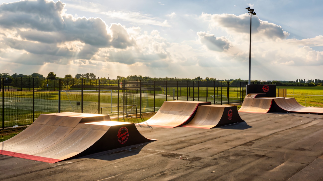 A run of quarter pipes and rollers beside the playing fields