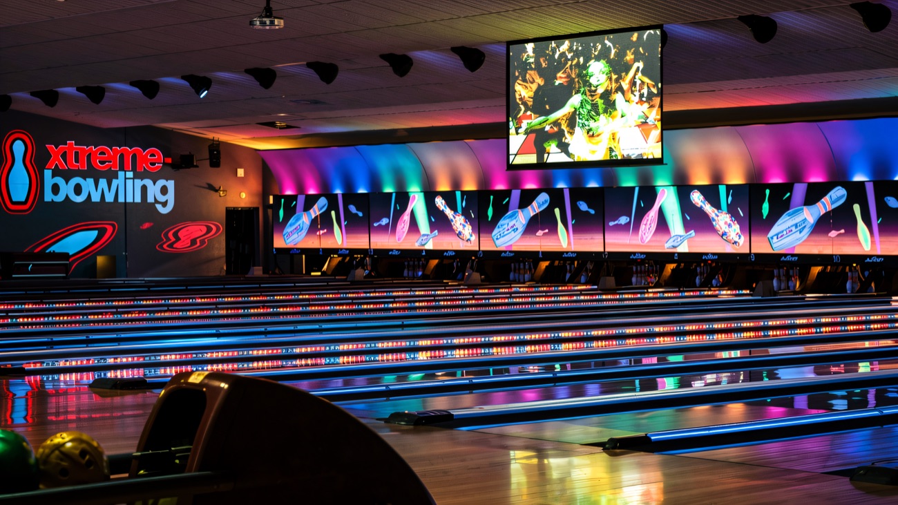 Xtreme bowling lanes glowing under the coloured lights
