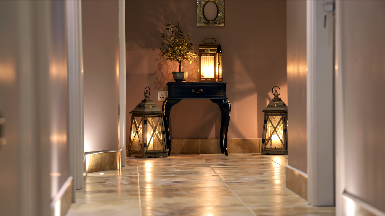 A candle-lit spa corridor with lanterns and a soft, quiet glow.