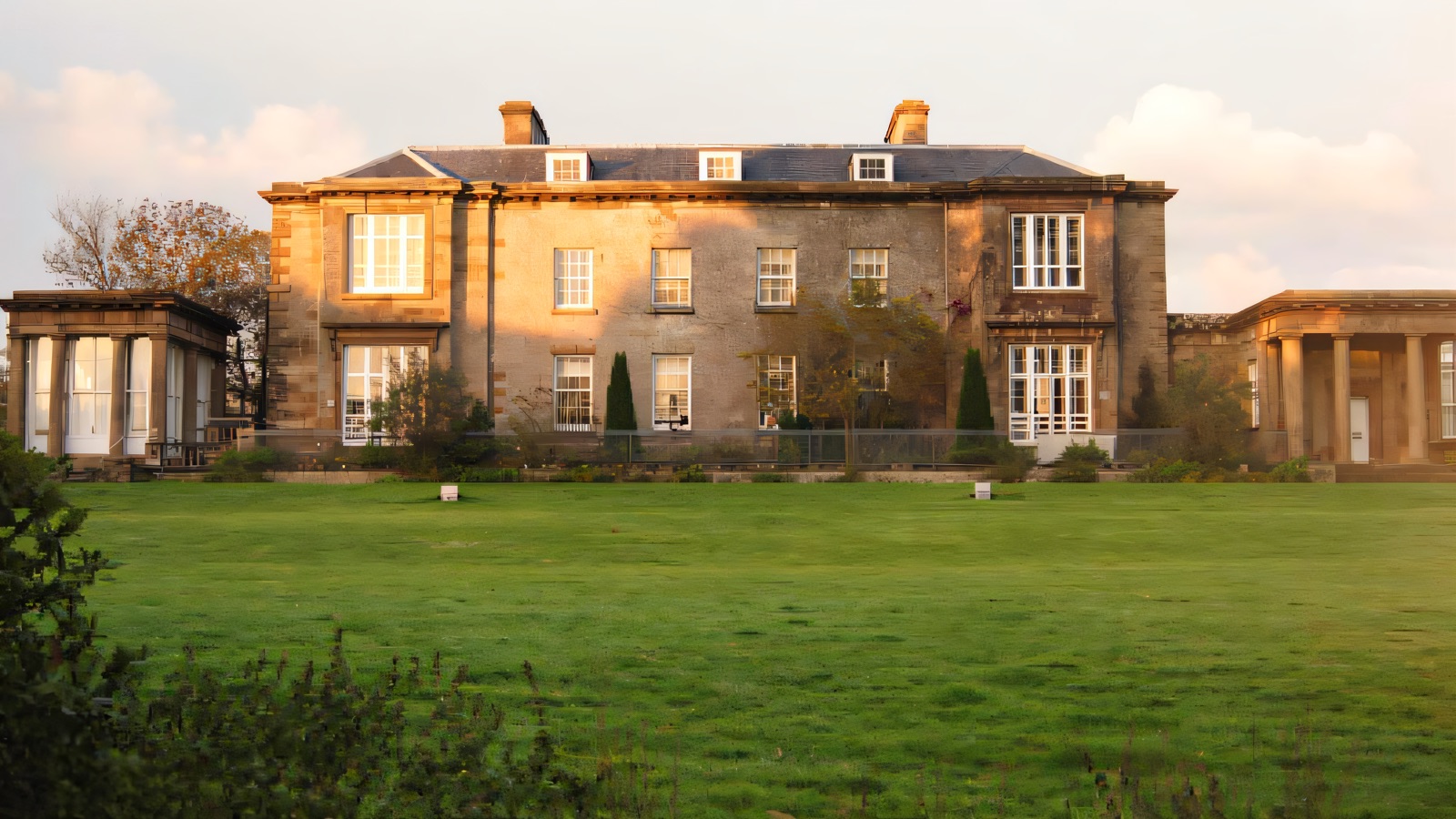 Cromore House across its parkland lawn, flanked by two colonnaded garden porches