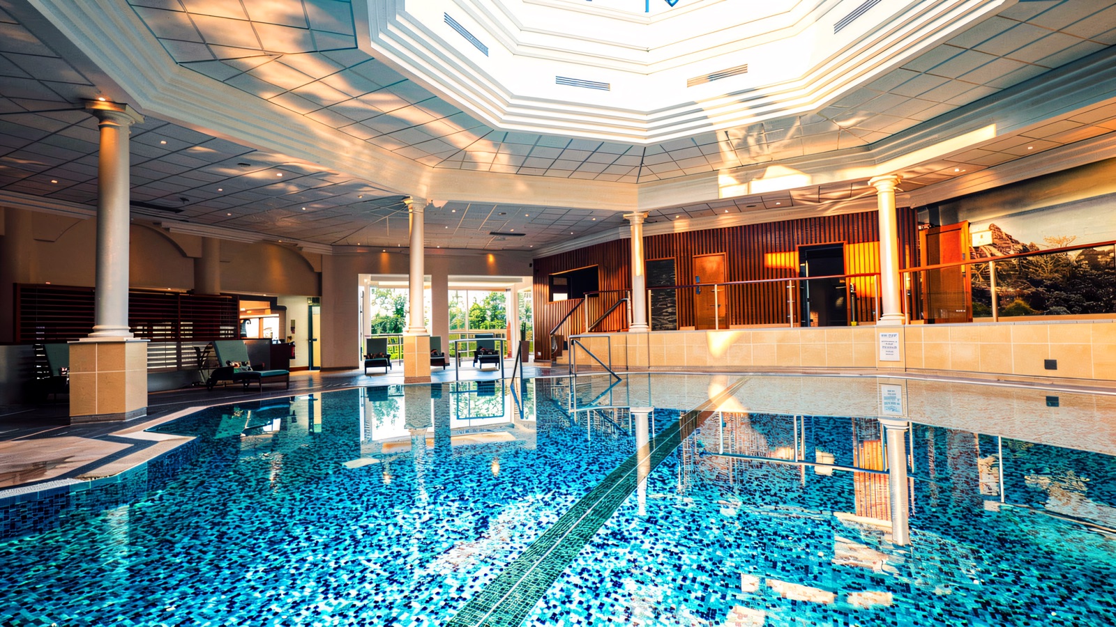 The Culloden spa pool sits under a domed skylight, ringed by pale columns.