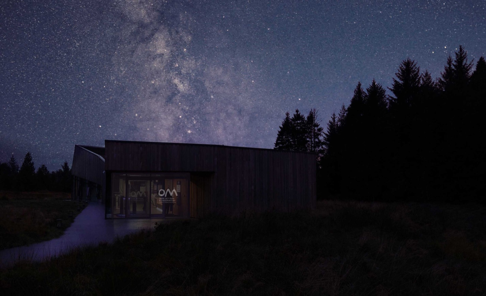 Tall conifers and forest trails at Davagh Forest and the OM Dark Sky Park