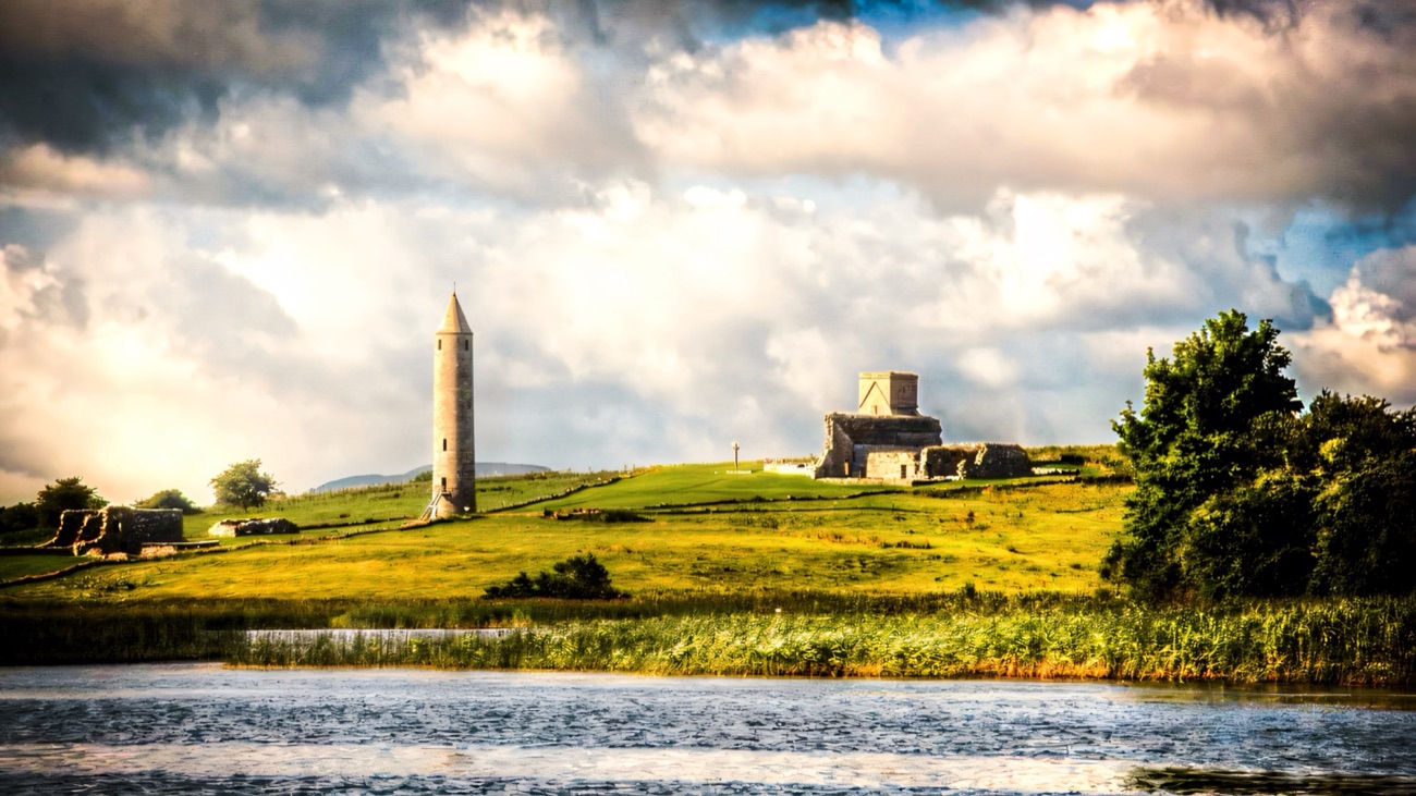 The round tower and priory ruins of Devenish Island rising above Lough Erne
