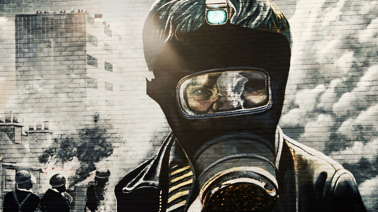 The People's Gallery mural of the gas-masked figure, one of the tour's best-known works.
