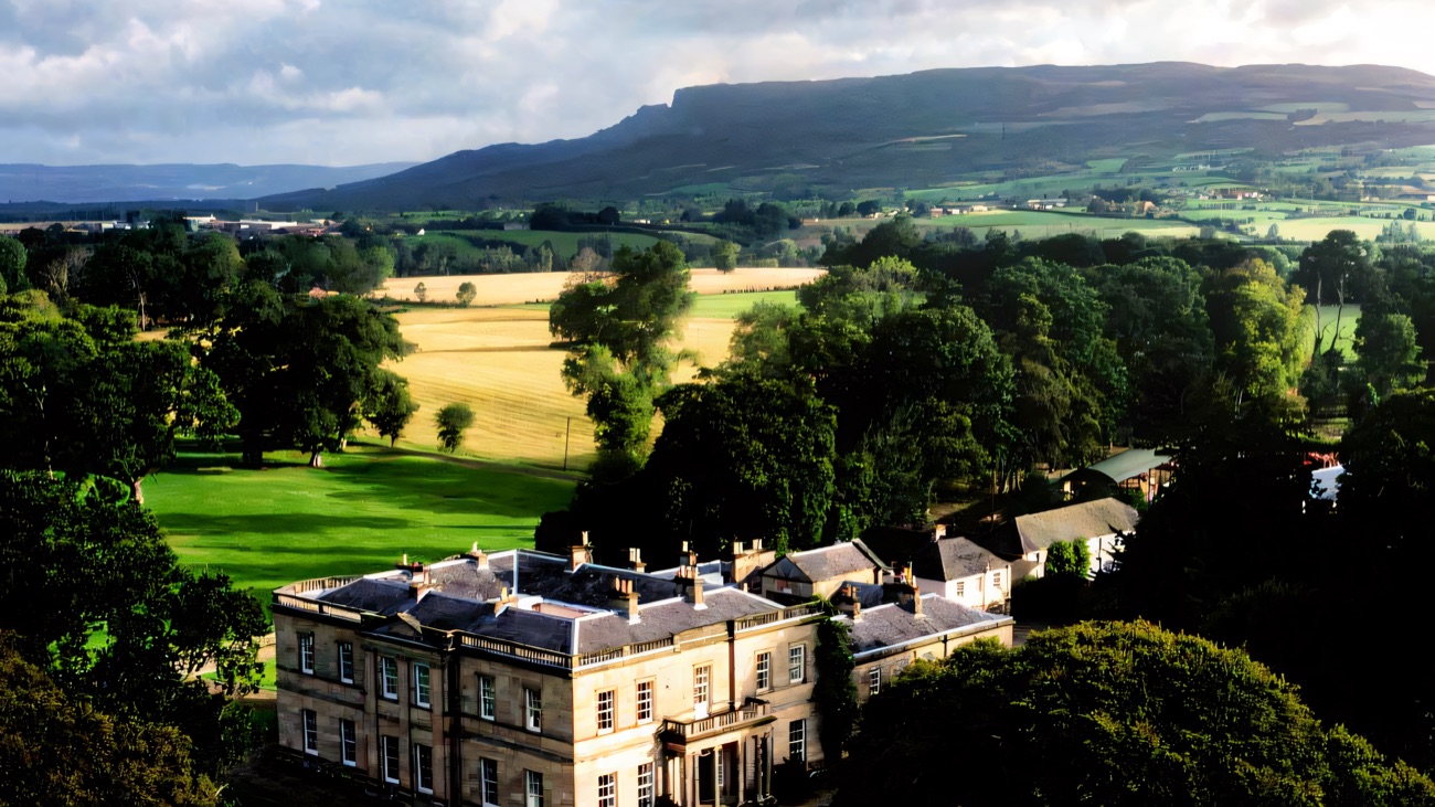 Drenagh mansion set in its parkland with Binevenagh mountain rising behind