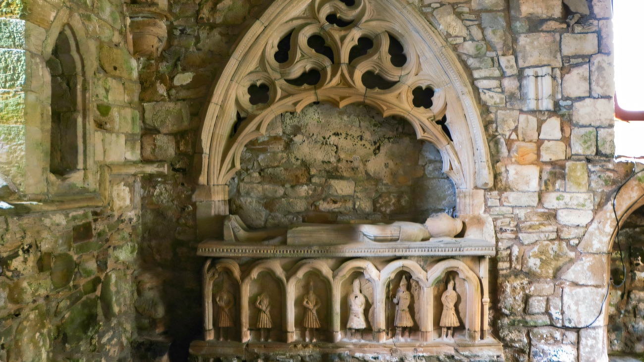The O'Cahan tomb, its carved warriors set beneath a beautiful Gothic canopy