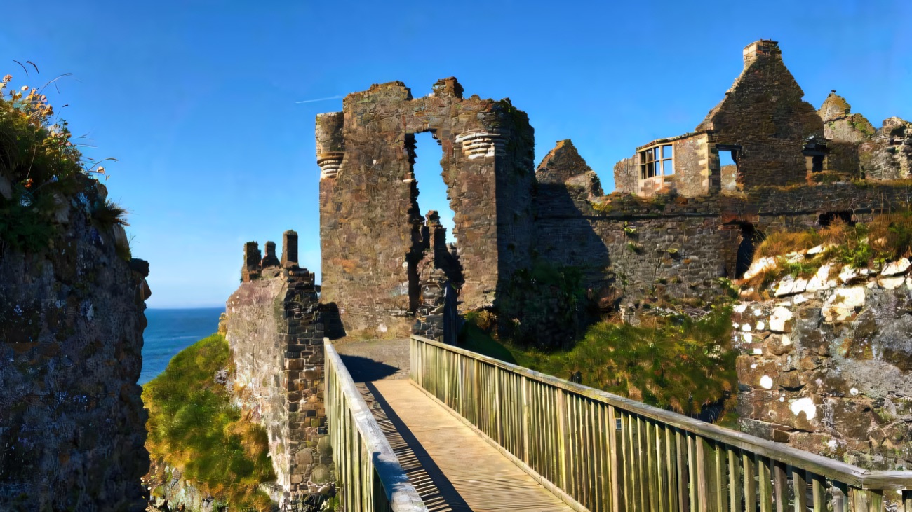The wooden bridge leading across onto the rock and into the ruined towers and gatehouse