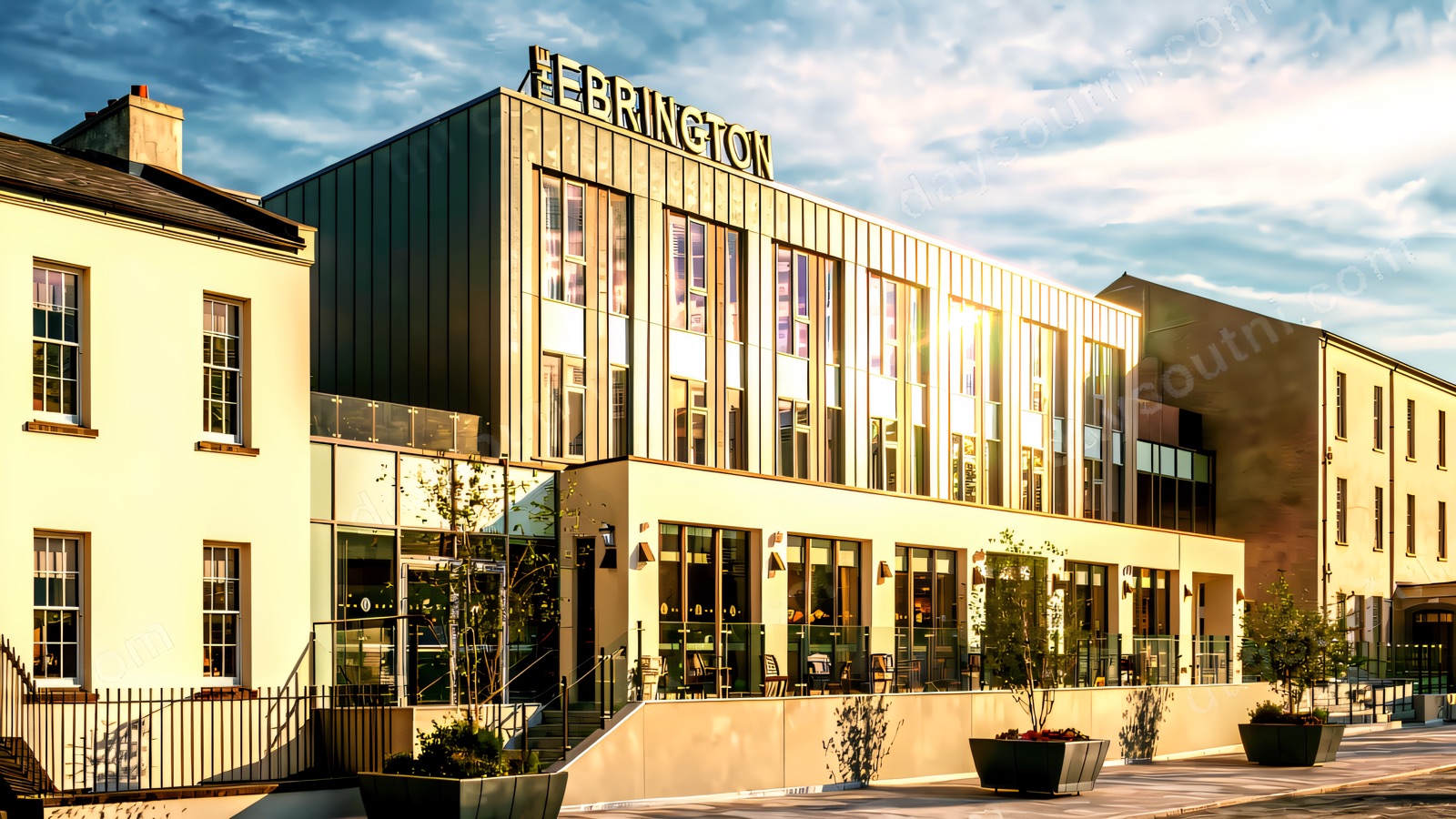 The Ebrington Hotel exterior on Ebrington Square in Derry, warm evening light on the stone frontage.