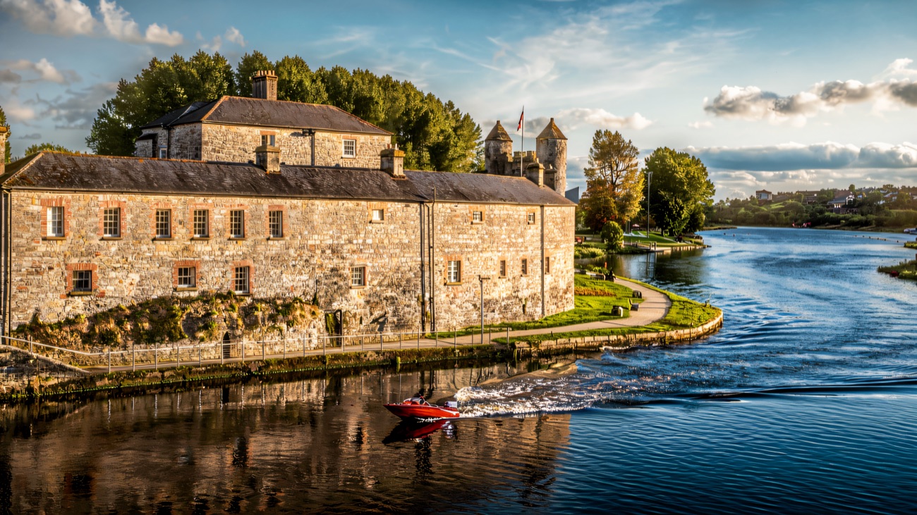 Enniskillen Castle from above, sitting on the River Erne with the wider Fermanagh lakelands stretching away behind