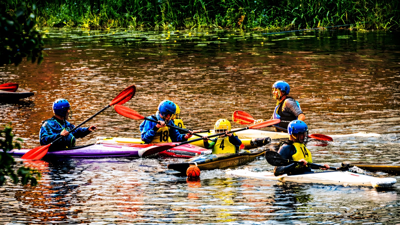 Club paddlers in the thick of a canoe-polo session.